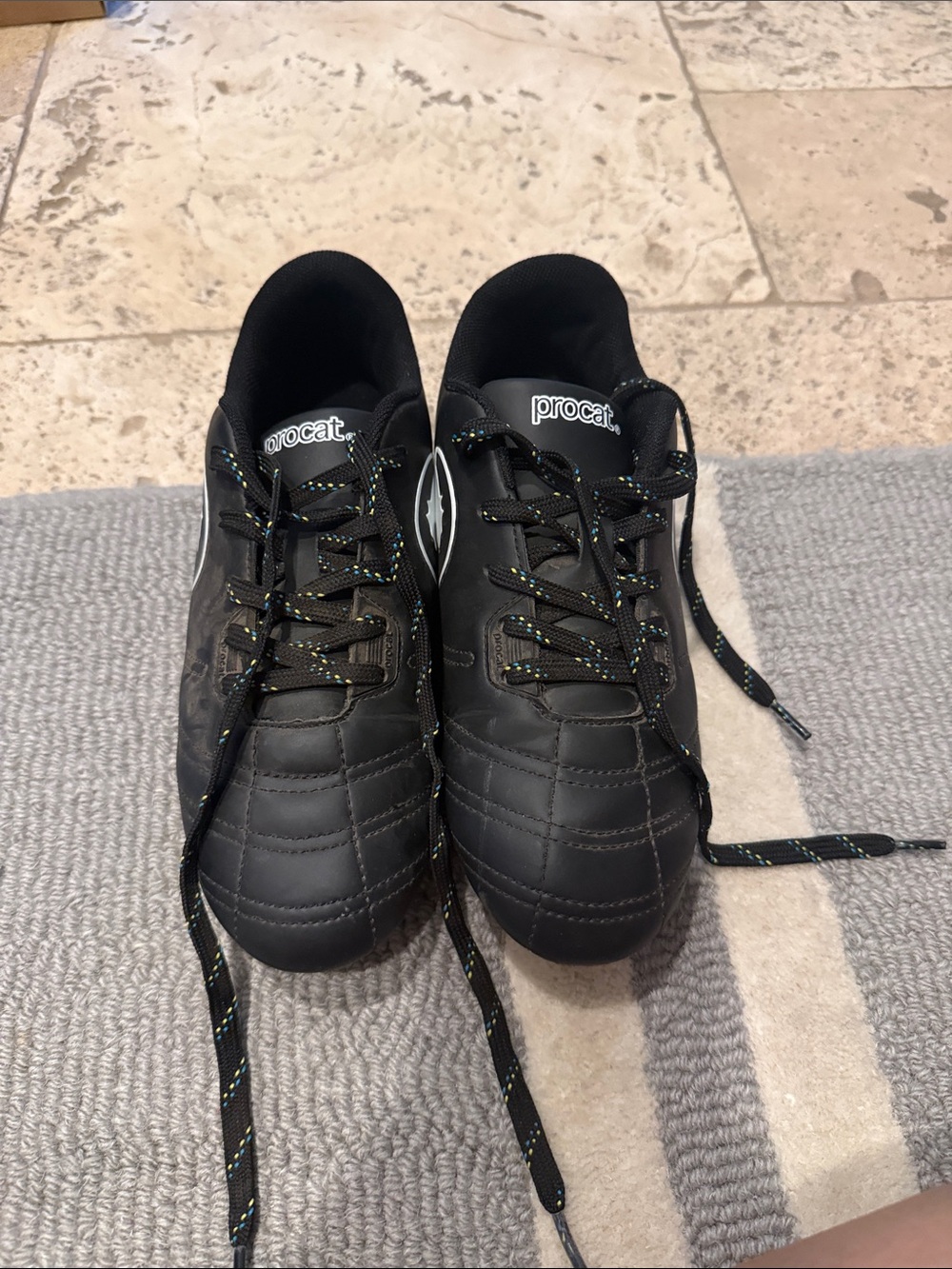 Puma Kids Black Athletic Soccer Cleats with Subtle Yellow-Green Accents
